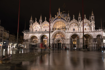 Fototapeta na wymiar Basilica in San Marco square in Venice during aqua alta