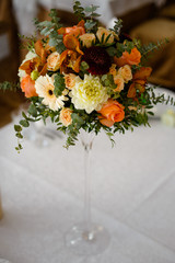 wedding decor on tables, a bouquet of flowers with a glass vase