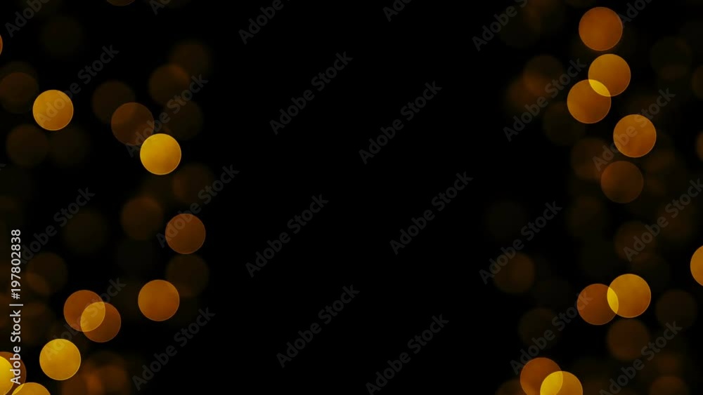 Poster splash screen for a title with golden particles at the left and right. seamless loop.