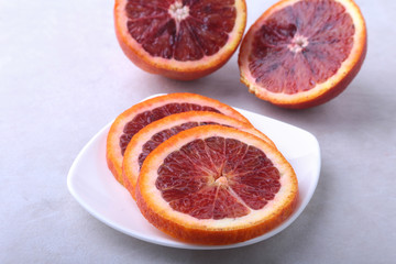 Naklejka na ściany i meble Orange fruit. Orange and lemon slice on white plate. Top view.
