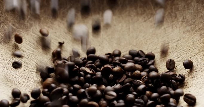 Closeup slow motion shot of roasted coffee beans
