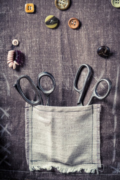 Vintage scissors in old pocket in tailor workshop