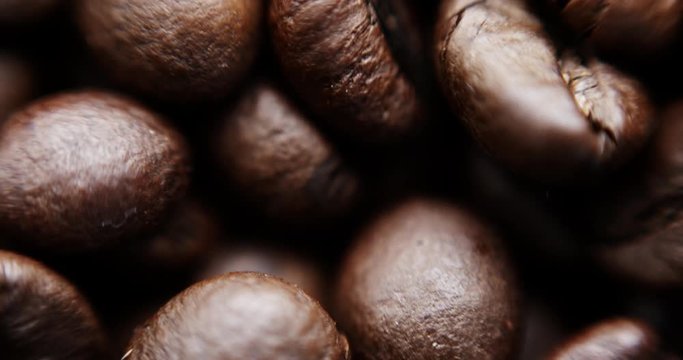 Closeup slow motion shot of roasted coffee beans