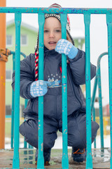 the boy poses with a winter cap