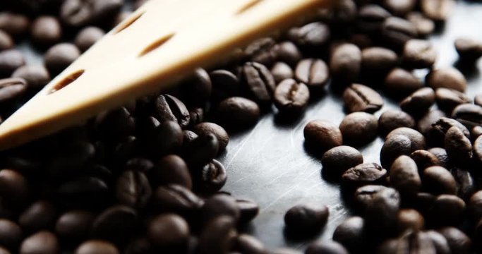 Closeup slow motion shot of roasted coffee beans