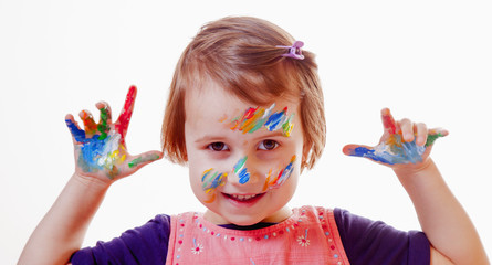 Beauty concept. Children's art makeup. Portrait of little beautiful children girl with colored face.