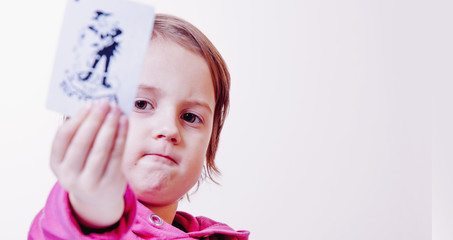 This is my chance. Portrait of a little beautiful child girl with joker. Сoncept of opportunities and realize full potential.
