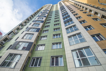 Fototapeta premium The facade of a modern multi-storey new residential building in Moscow 