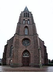 Fototapeta na wymiar Old Catholic church in the city of Garrel in Germany