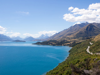 Fototapeta na wymiar Bennett's Bluff Lookout, New Zealand - A Viewpoint On One of the Most Scenic Drives in New Zealand that Connects Queenstown with Glenorchy and Overlooks Pig and Pigeon Islands and Lake Wakatipu