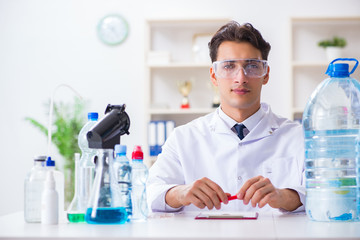 Fototapeta premium Lab assistant testing water quality