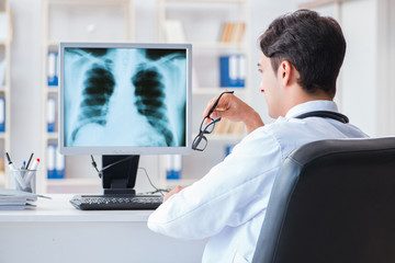 Doctor radiologist looking at x-ray images