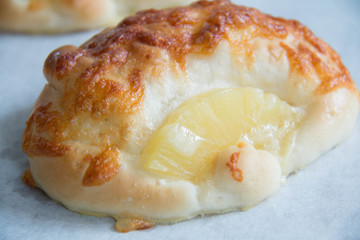 delicious cheese bread with pineapple on plate

