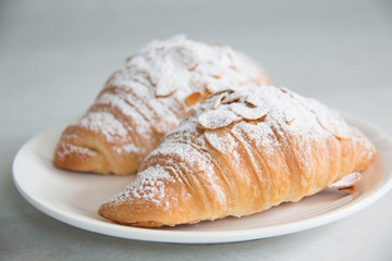  almond croissant on white paper