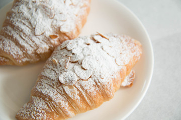 almond croissant on white paper