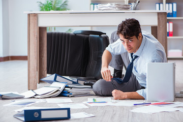 Bankrupt businessman angry in the office floor