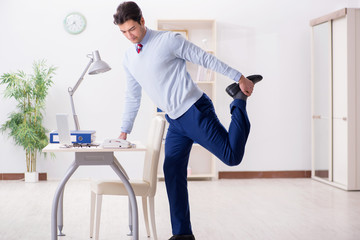 Employee doing stretching exercises in the office