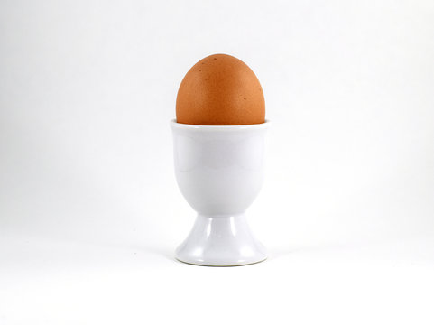 Egg cup with brown soft boiled egg