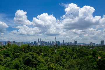 Fototapeta premium A clear and windy day in Kuala Lumpur, capital of Malaysia. Its modern skyline is dominated by the 451m tall KLCC, a pair of glass and steel clad skyscrapers.