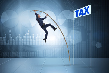 Businessman jumping over tax in tax evasion avoidance concept