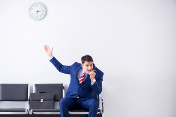 Man wairing to boarding in airport lounge room