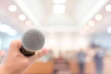 Microphone in conference on seminar room event background	