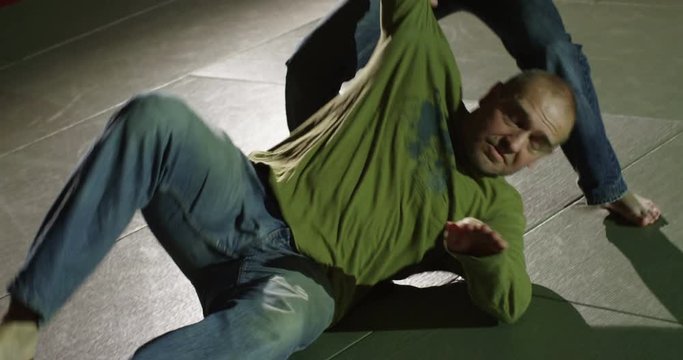 Martial arts athletes showcase self defense techniques.
