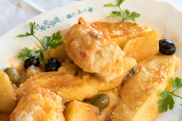 Cod with tomatoes and polenta