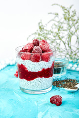 Healthy chia pudding with raspberries in glass
