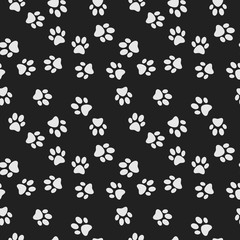 Fototapeta na wymiar Dog paw print dark vector seamless pattern