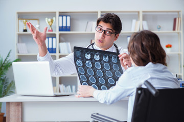 Doctor explaining to patient results of x-ray imaging