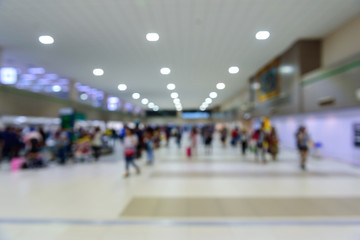 People walking with blurred theme in the hall.