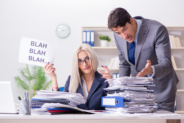 Angry boss yelling at his assistant secretary