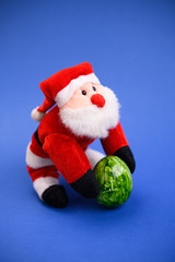 little santa claus with green easter egg