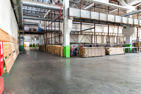 Warehouse of lumber at the woodworking plant. Shop woodworking plant