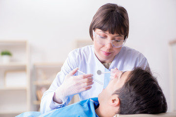 Patient visiting dentist for regular check-up and filling