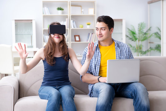 Young family playing games with virtual reality glasses