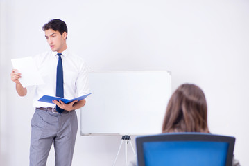 Business presentation in the office with man and woman