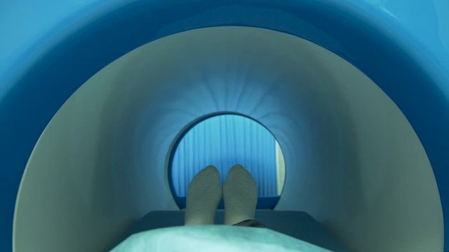 A patient moving out of mri scan machine