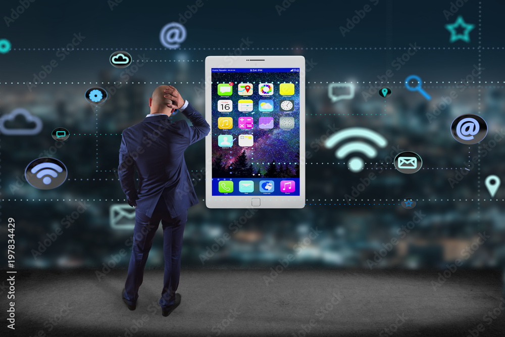 Poster Businessman in front of a wall with a tablet surrounding by app and social icon - 3d render