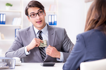 Businessmanbeing offered bribe for breaking law