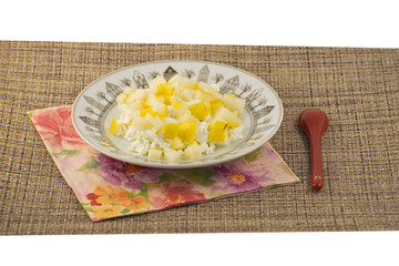 Cottage cheese with pear on the plate. Fresh curd, sour cream and pear for healthy eating.