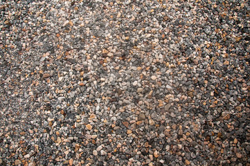 stone car park,a lot of rock and gravel background texture.