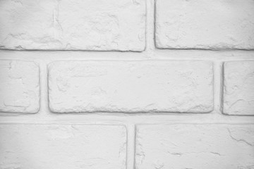 Brick wall painted white with grainy texture, aligned for backgrounds and entourage. Stucco covered with paint finish. Desaturated and processed for nuetral white balance.