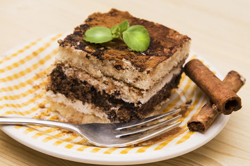 delicious tiramisu on wooden background