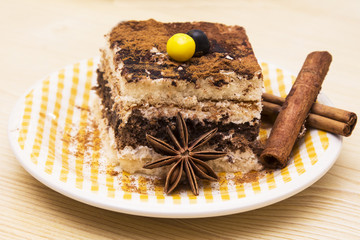 delicious tiramisu on wooden background