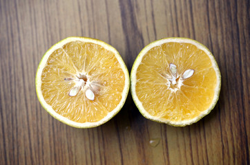 Fototapeta na wymiar Slice of orange over white background, Sweet Lemon isolated on white background