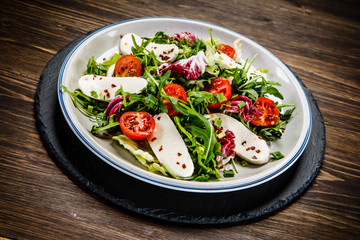 Greek salad on wooden background