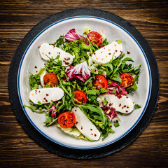 Greek salad on wooden background