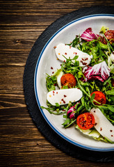 Greek salad on wooden background